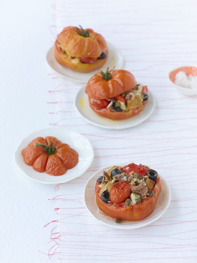 Three stuffed oxheart tomatoes with vegetarian filling