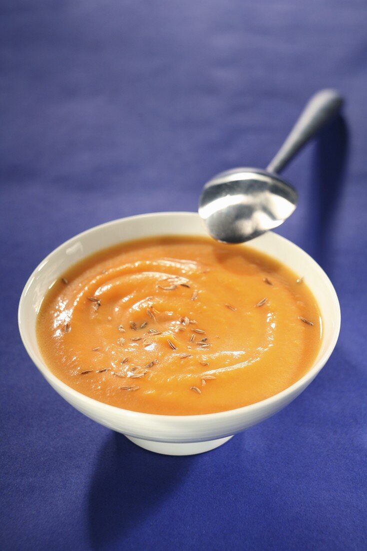 Pumpkin cream soup with fennel seeds in a soup bowl