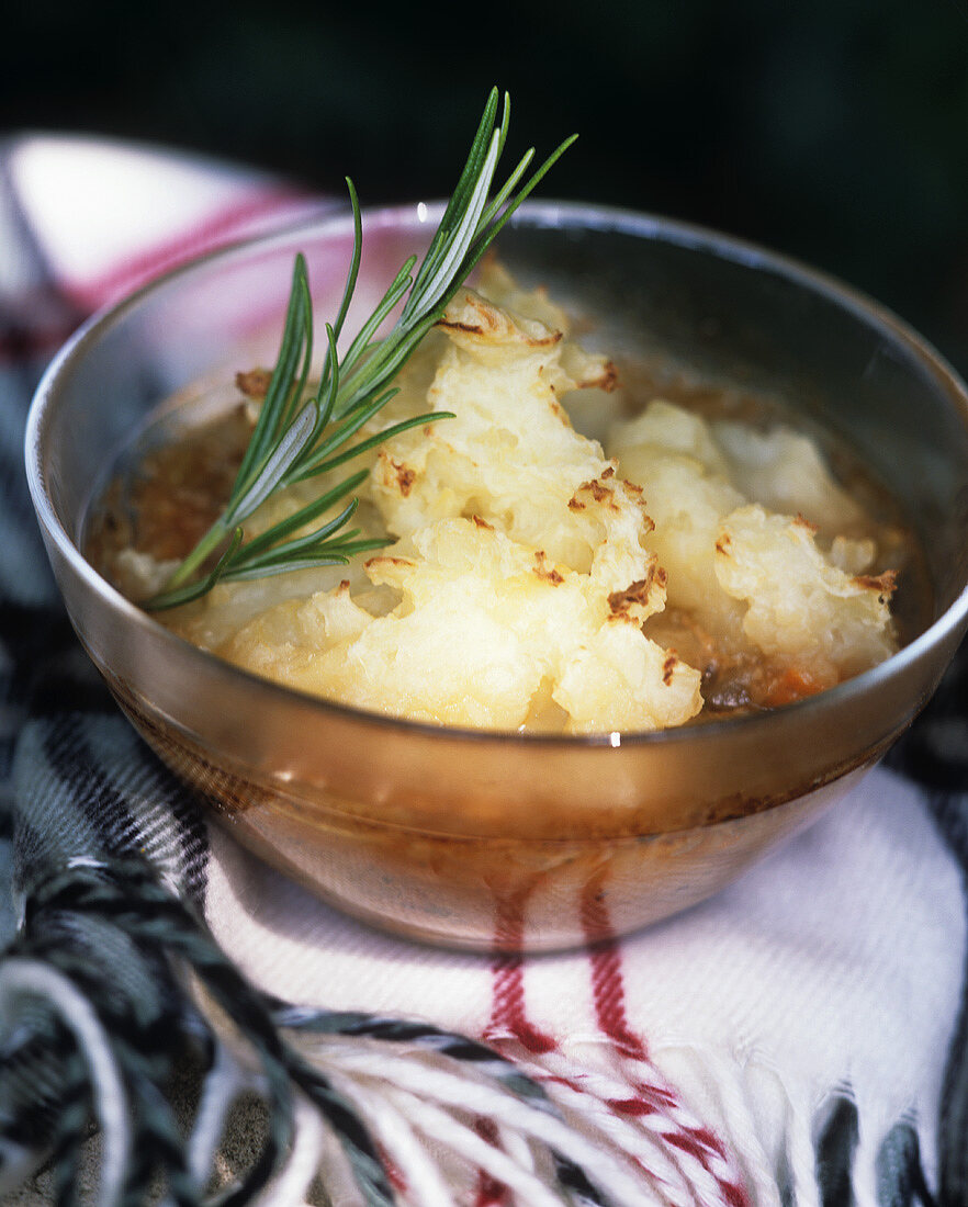 Baked minced lamb with potato snow and rosemary