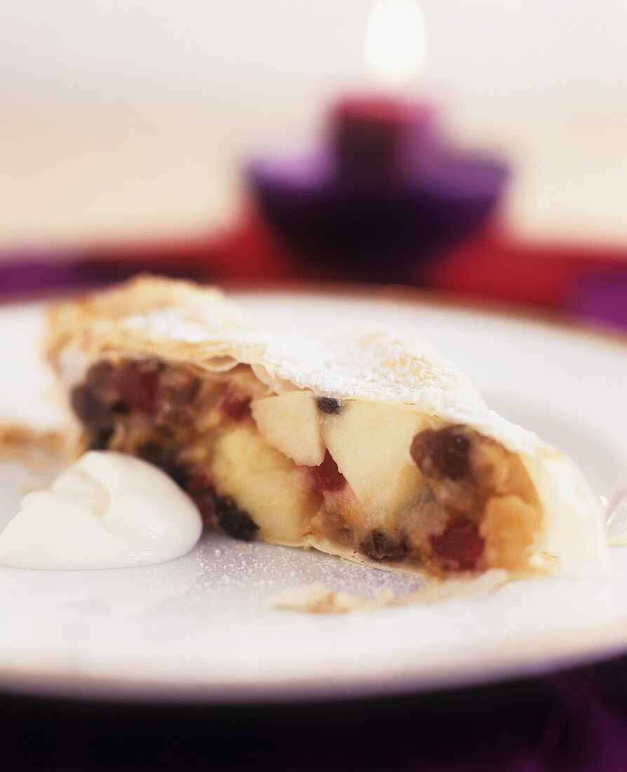 Apple strudel with dried fruit, almonds and honey