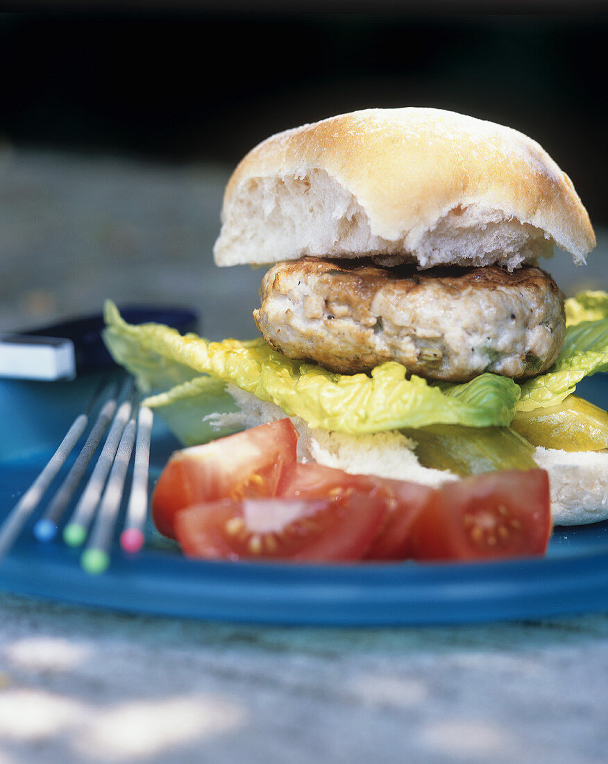 Turkey burger with gherkin, lettuce and tomato