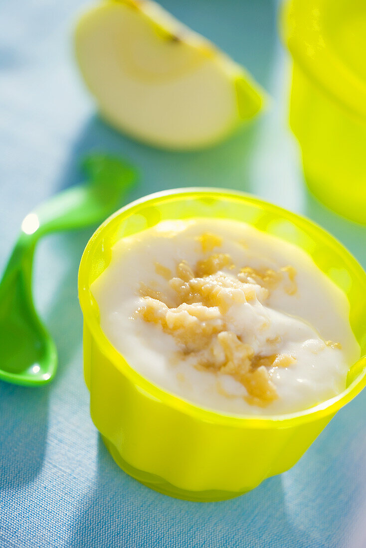 Grated apple with blancmange in child's tableware
