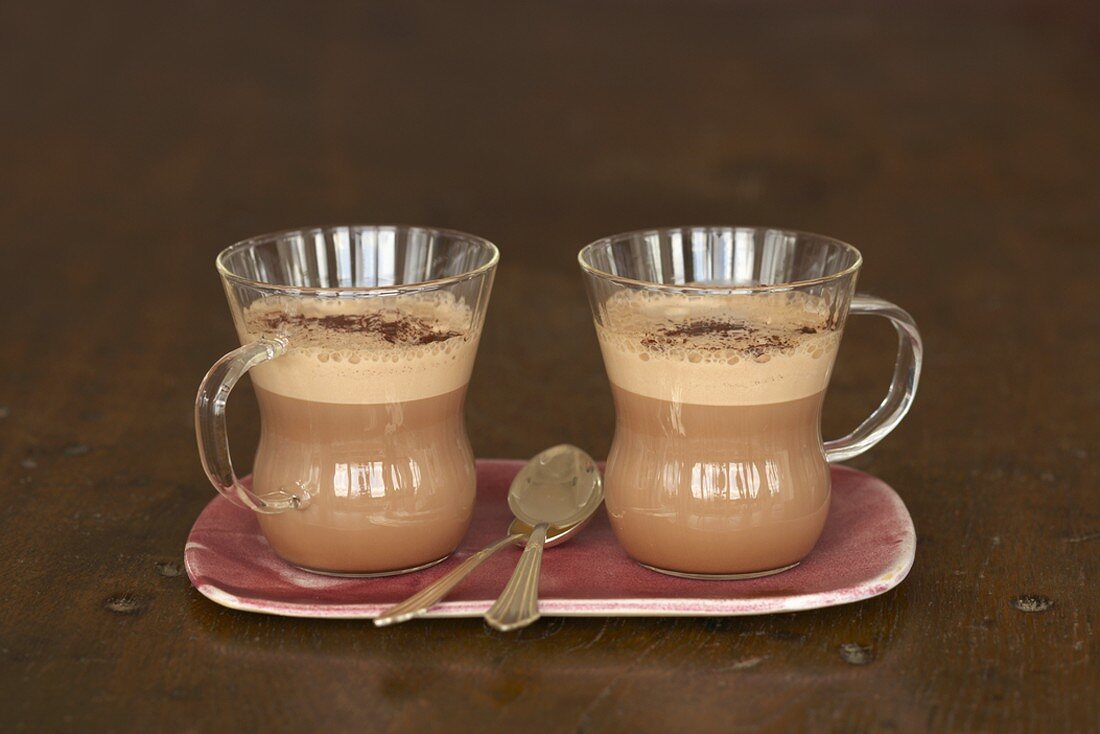 Two glass cups of hot chocolate
