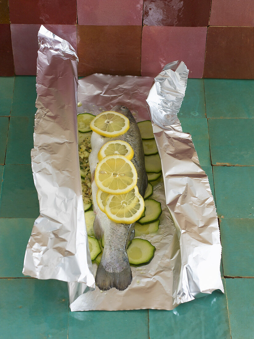 Whole trout with apple and mint stuffing in aluminium foil