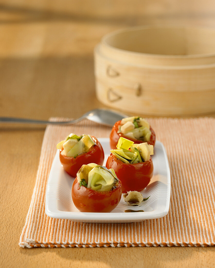 Tomatoes stuffed with vegetables, cooked in bamboo steamer
