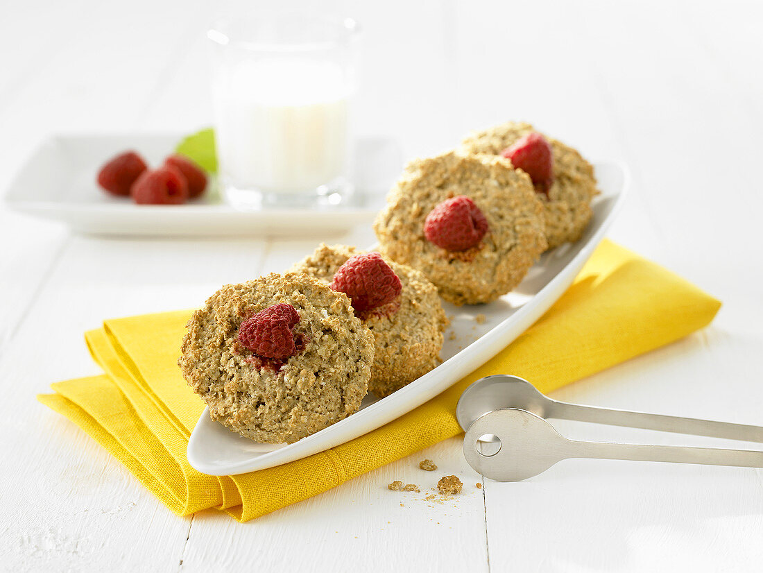 Four oat biscuits with raspberries