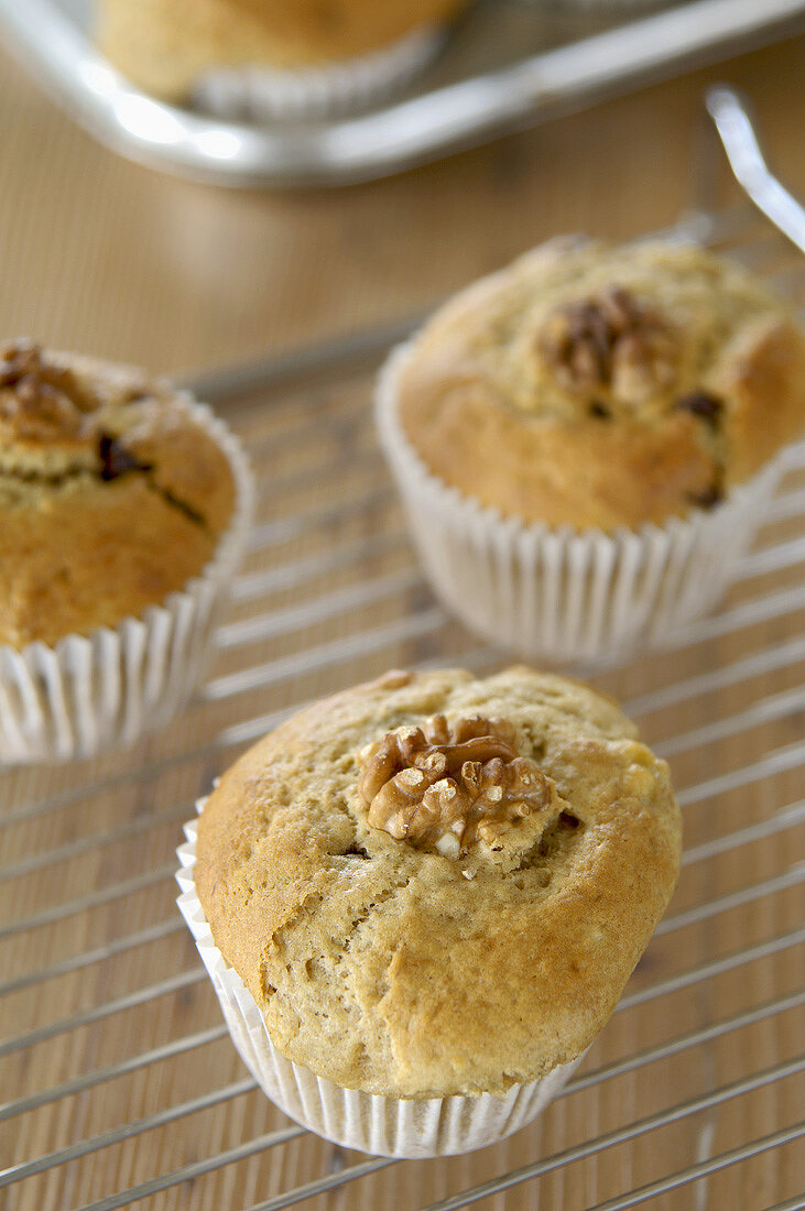 Banana and chocolate muffins on a cake rack