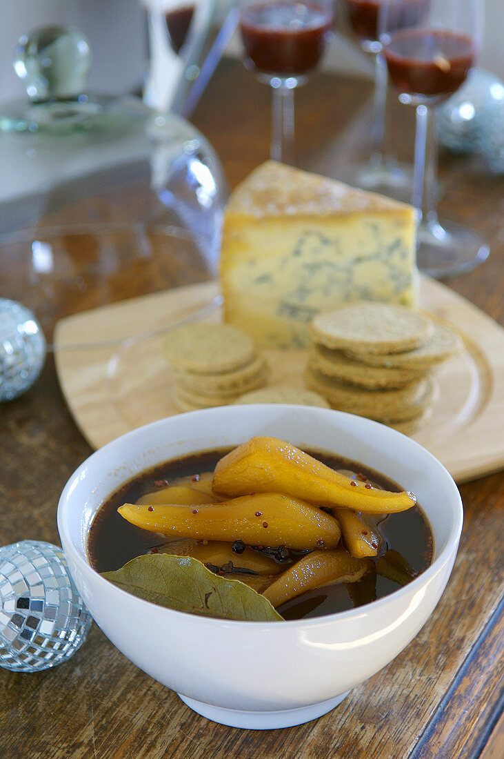 Spicy pickled pears with cheese and crackers