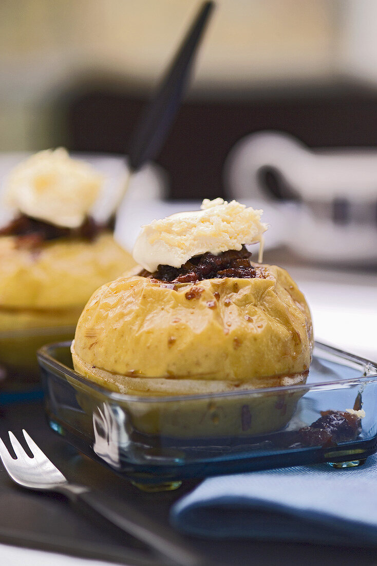 Two baked apples stuffed with raisins and nuts