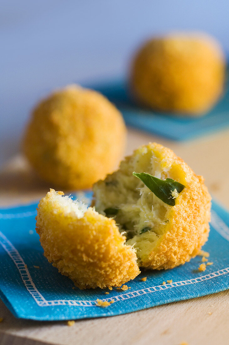 Deep-fried fish balls, two whole and one halved