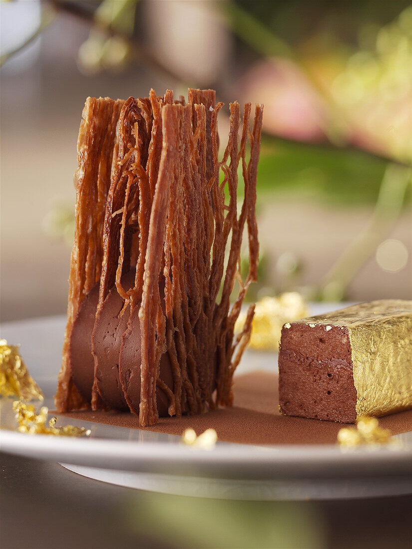 Chocolate dessert with gold leaf