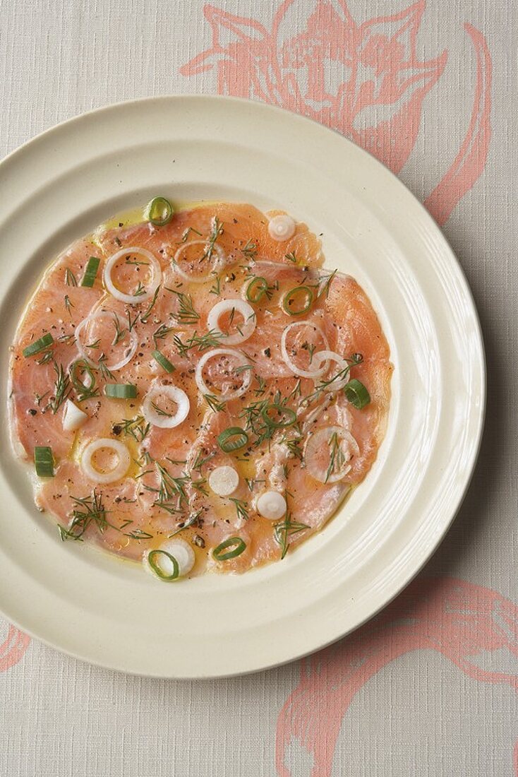 Salmon carpaccio with spring onions and dill