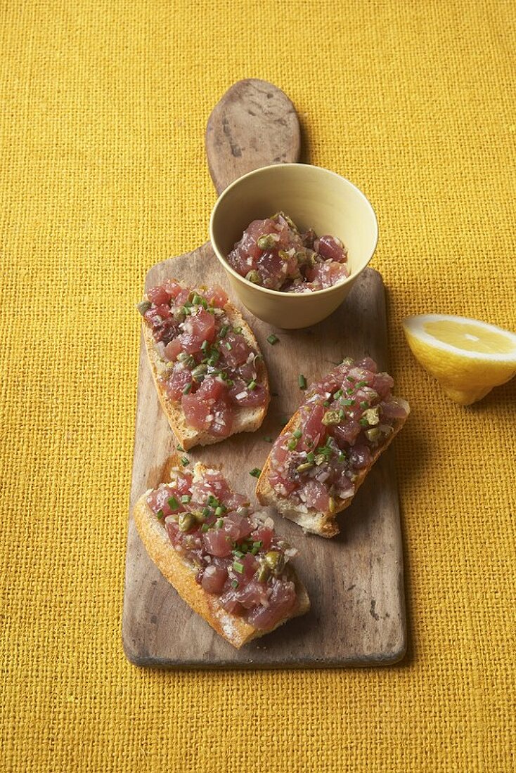 Tartine with tuna tartare, capers and ginger oil