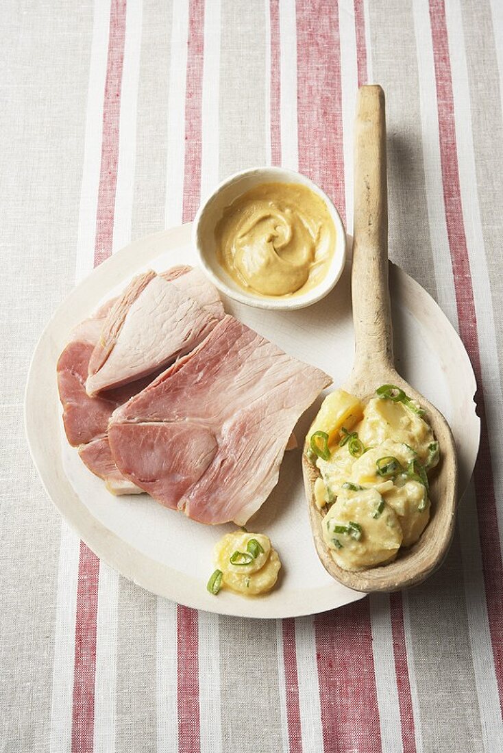 Pork shoulder with potato salad and mustard sauce