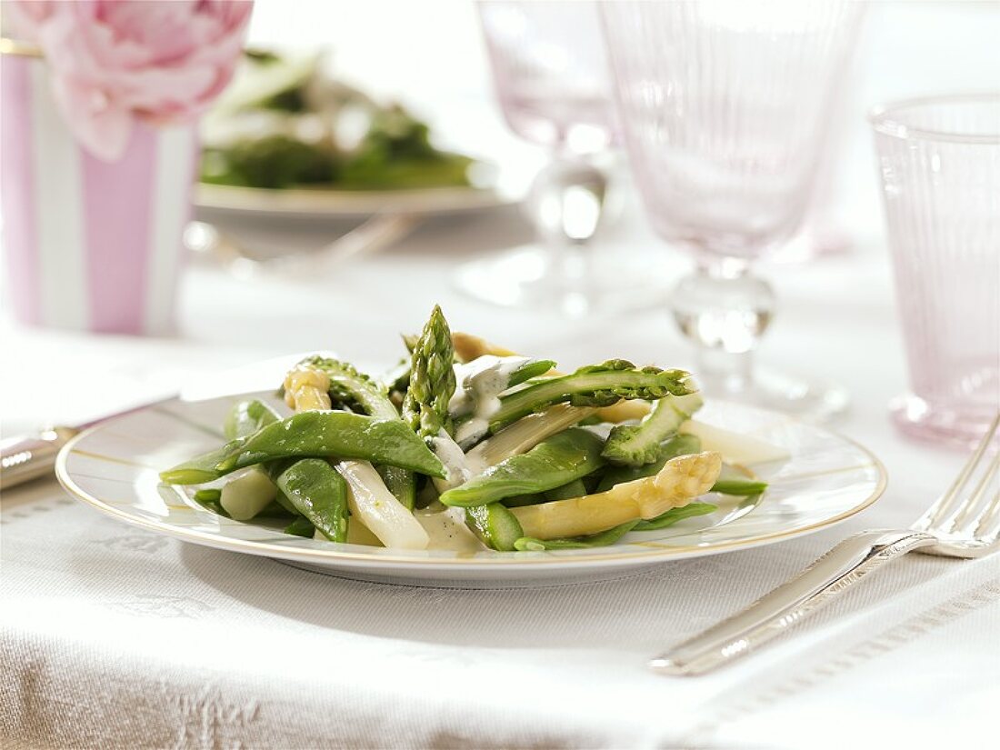 Steamed white and green asparagus with beans