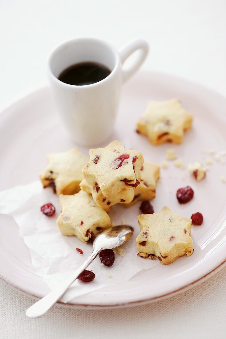 Star-shaped cranberry shortbread cookies with a cup of coffee