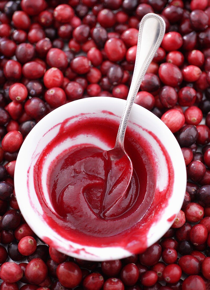 Home-made cranberry sauce in dish on cranberries