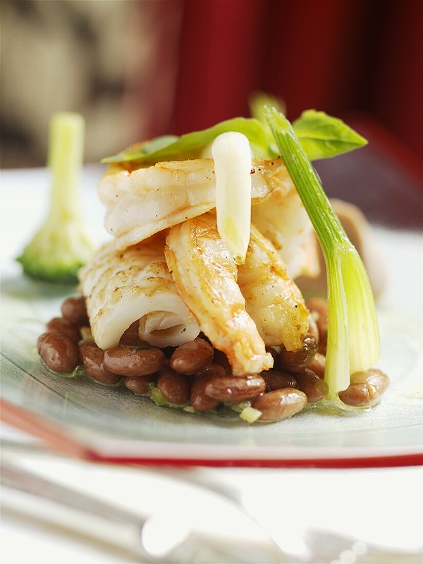 Fried prawns and squid on beans