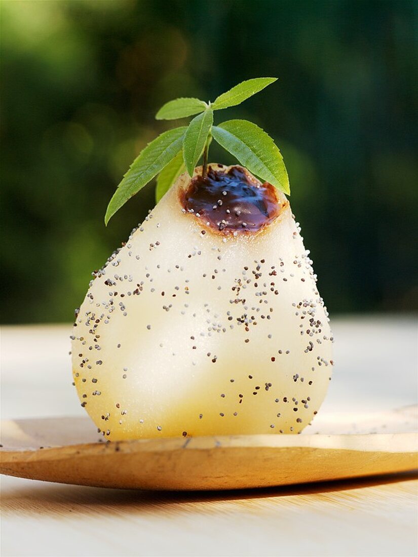 Poached pear filled with chocolate sauce