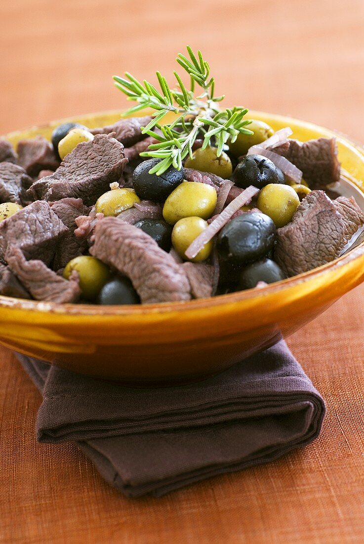 Braised beef with olives and rosemary