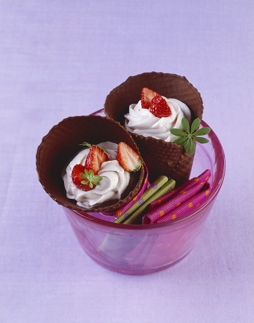 Strawberry cream with strawberries in two chocolate cones