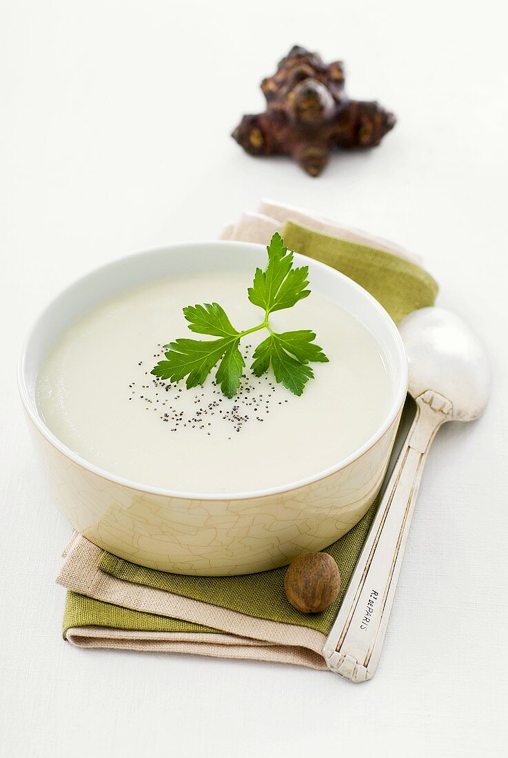 Jerusalem artichoke soup with parsley in a bowl