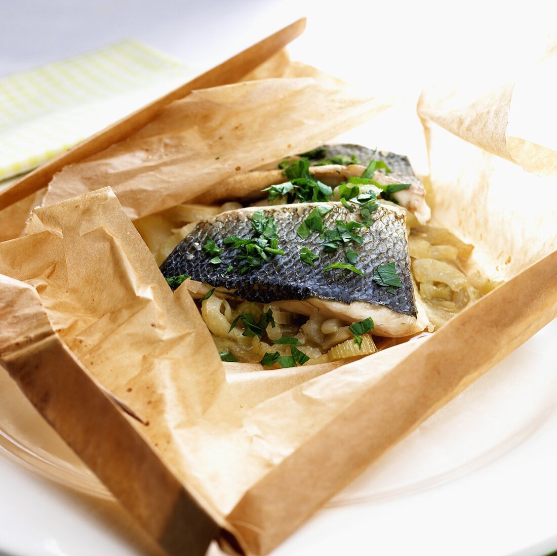 Sea bass on fennel cooked in baking parchment
