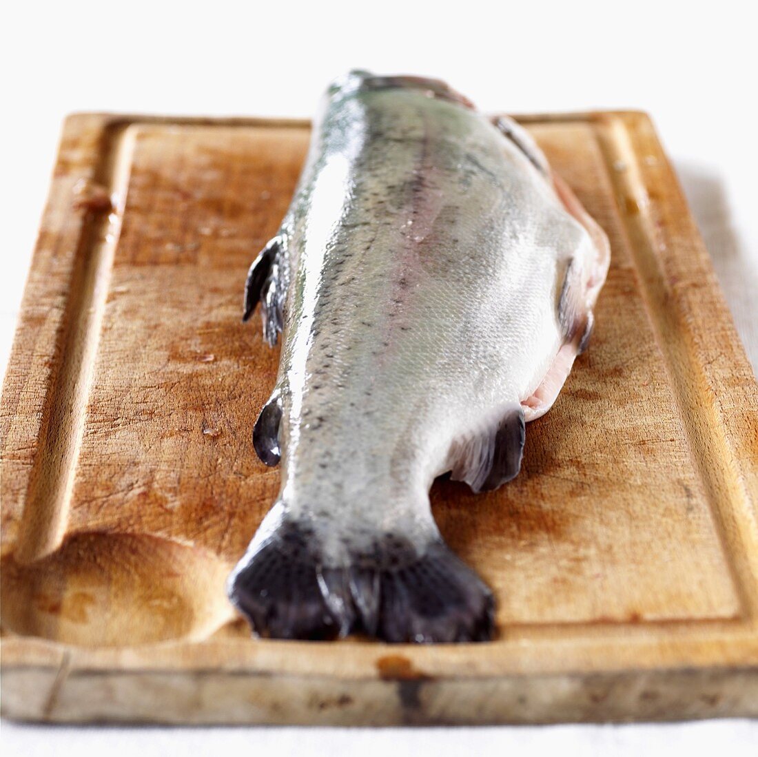 A trout on a wooden board