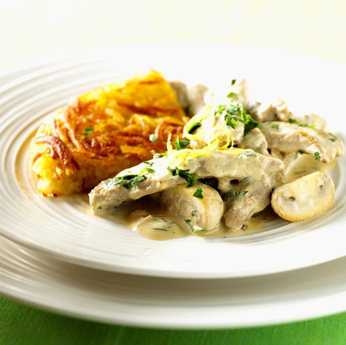 Kalbsgeschnetzeltes mit Champignons und Rösti