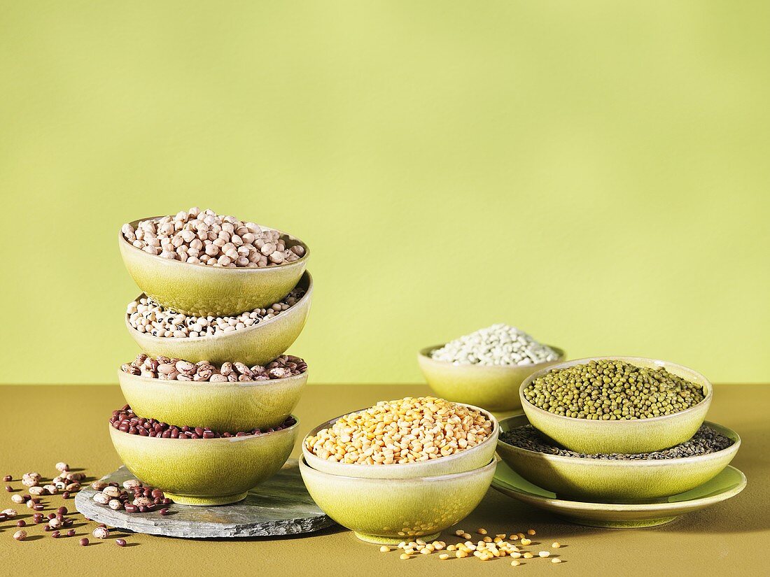 Assorted dried lentils and beans in bowls