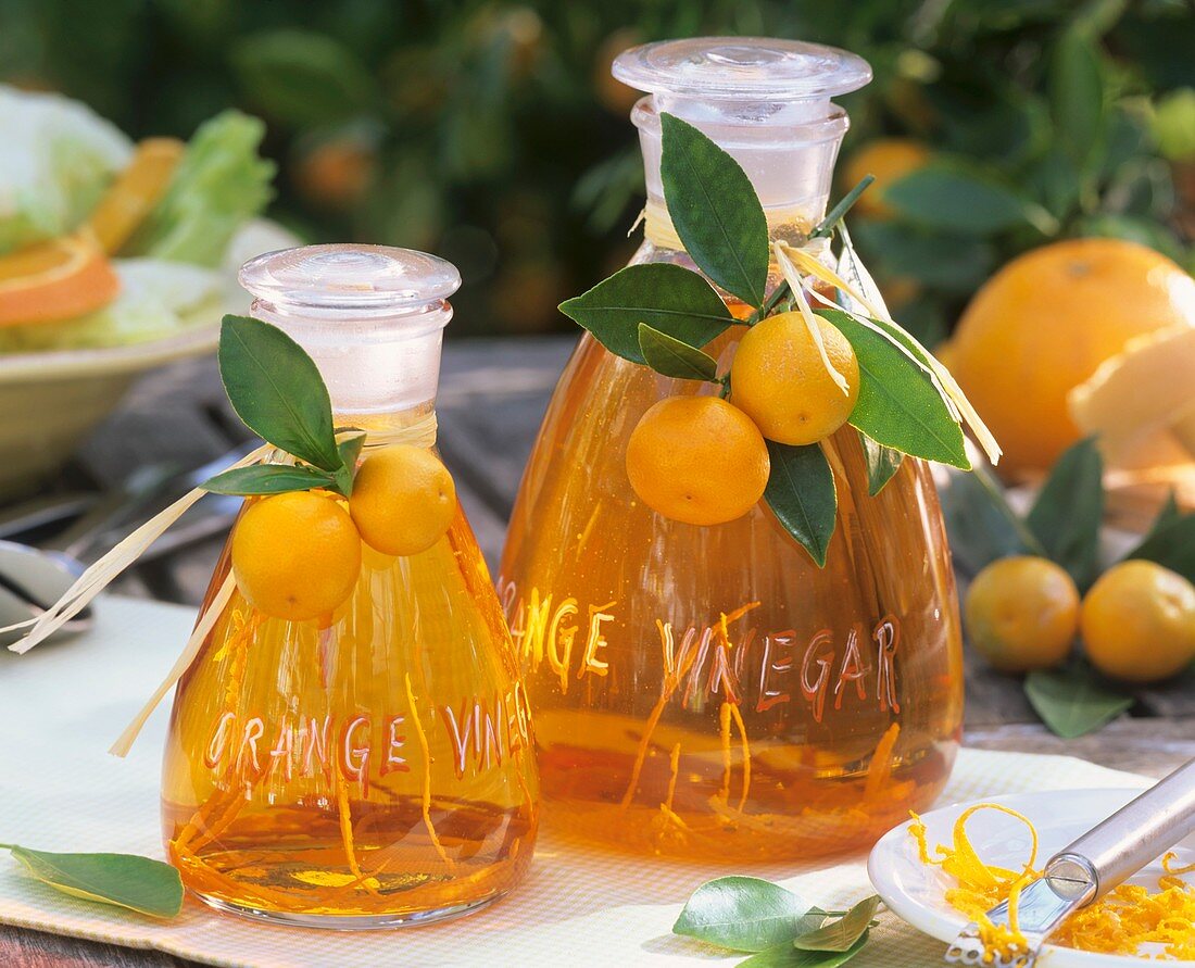 Orange vinegar in two glass carafes