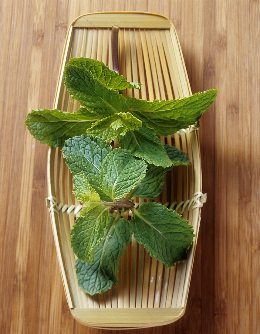 Mint in a small bamboo basket