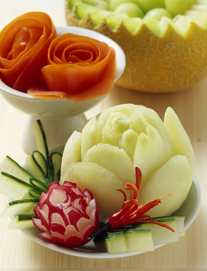 Carved vegetables and melon balls in a melon