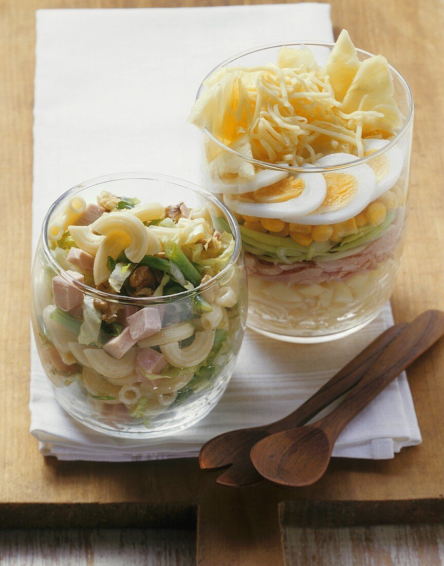 Pasta salad and ham and leek salad in glasses