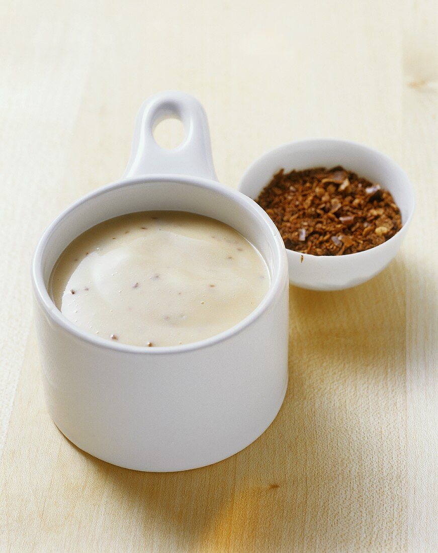 Chilli mayonnaise in a sauce jug with chilli flakes