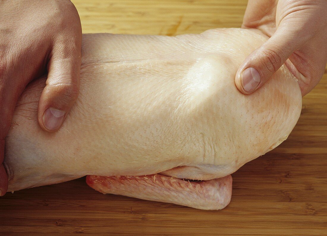 Peking duck: separating the skin from the meat