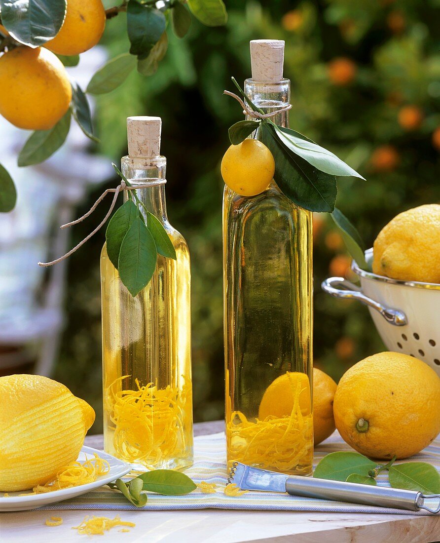Home-made lemon oil in two bottles out of doors