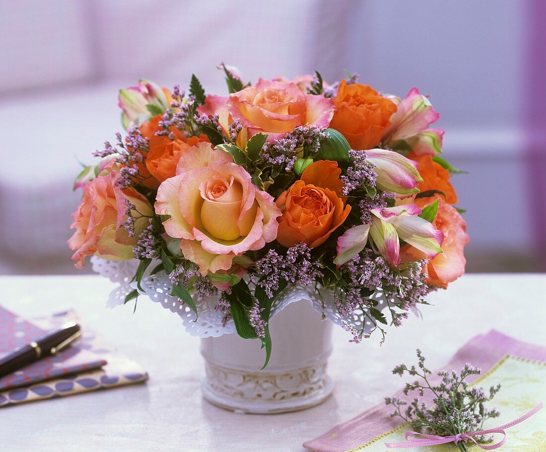 Arrangement of roses, limonium and pittosporum