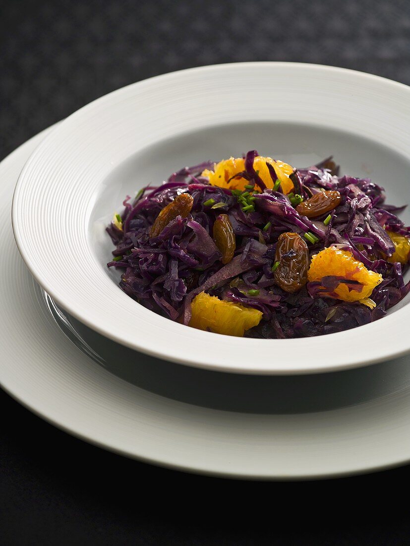 Red cabbage salad with orange segments and sultanas