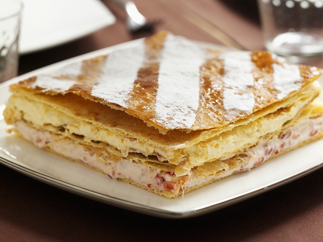 Millefeuille filled with whipped cream and berries