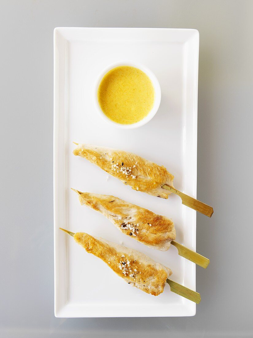 Fried turkey breast skewers with curry dip