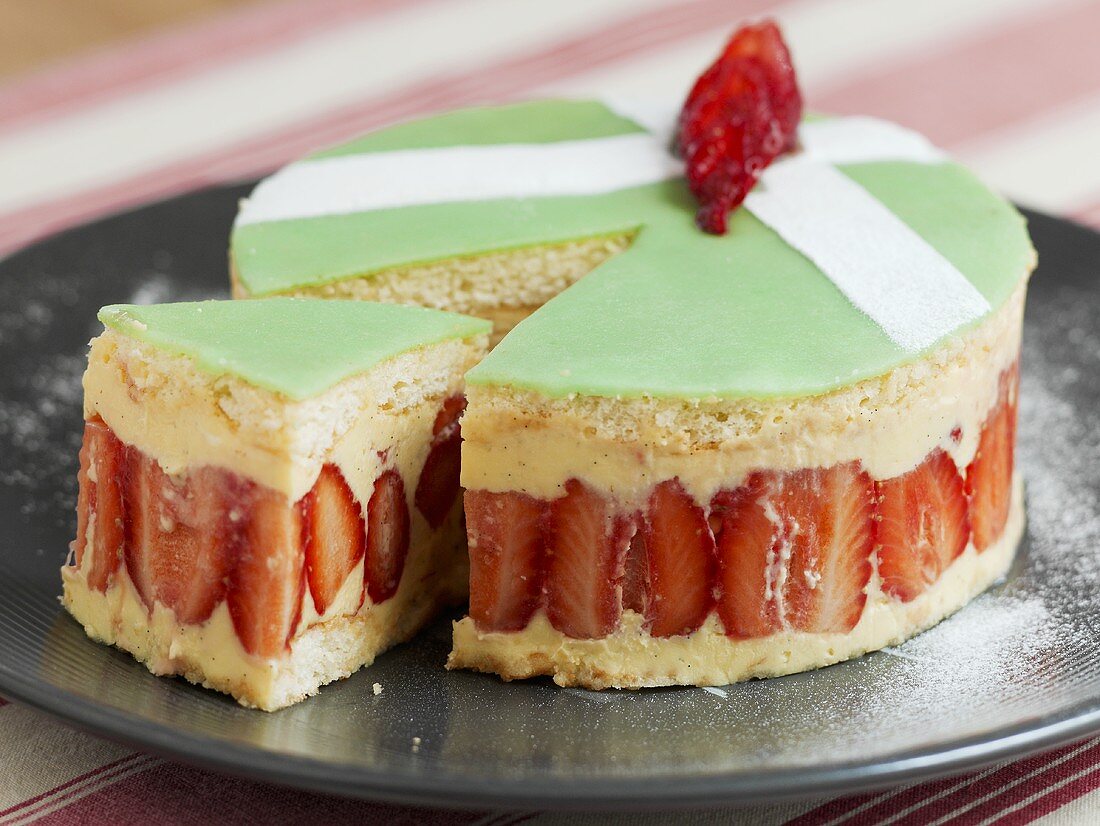 Strawberry sponge cake with vanilla cream and marzipan