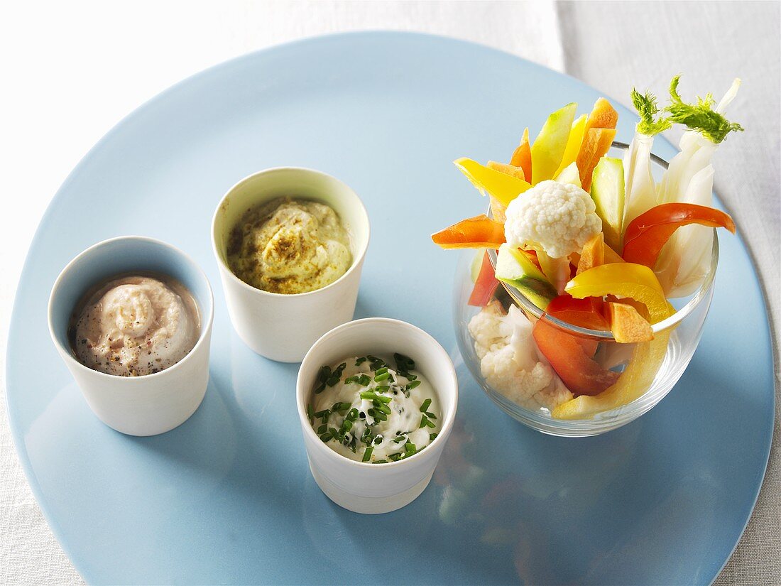 Vegetable sticks with three different cheese dips