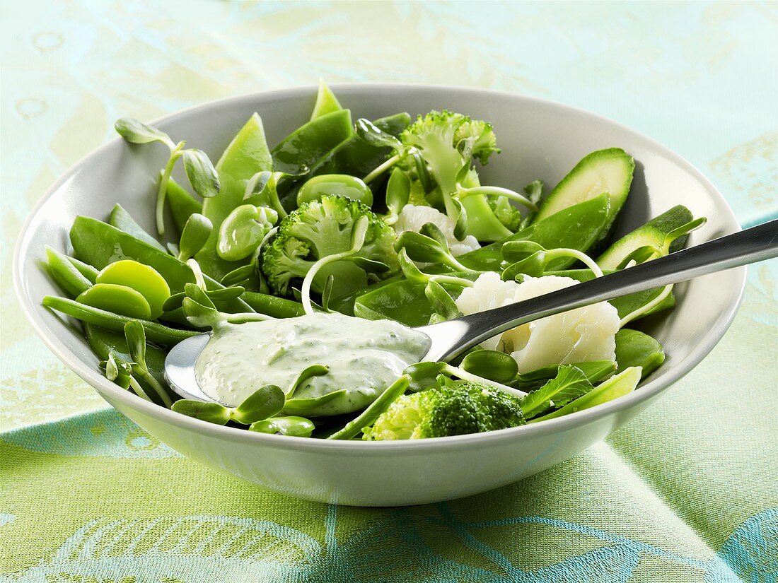 Green vegetable salad with minted yoghurt & soft cheese dressing