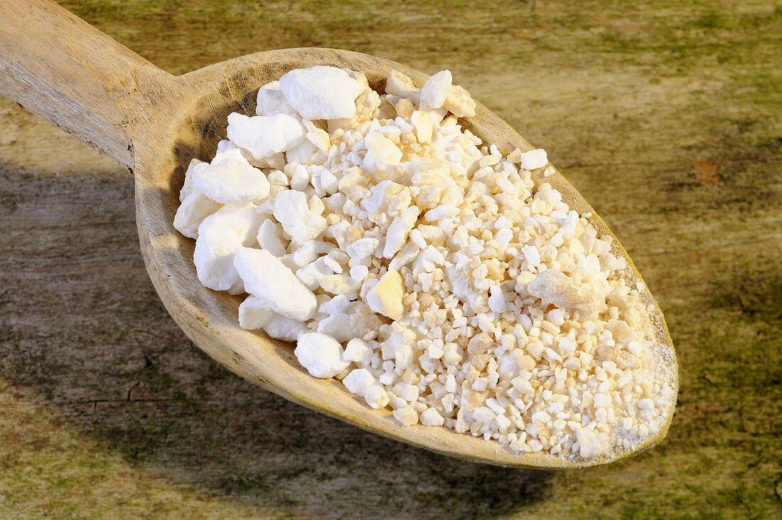 Dried sap of the manna ash on a wooden spoon