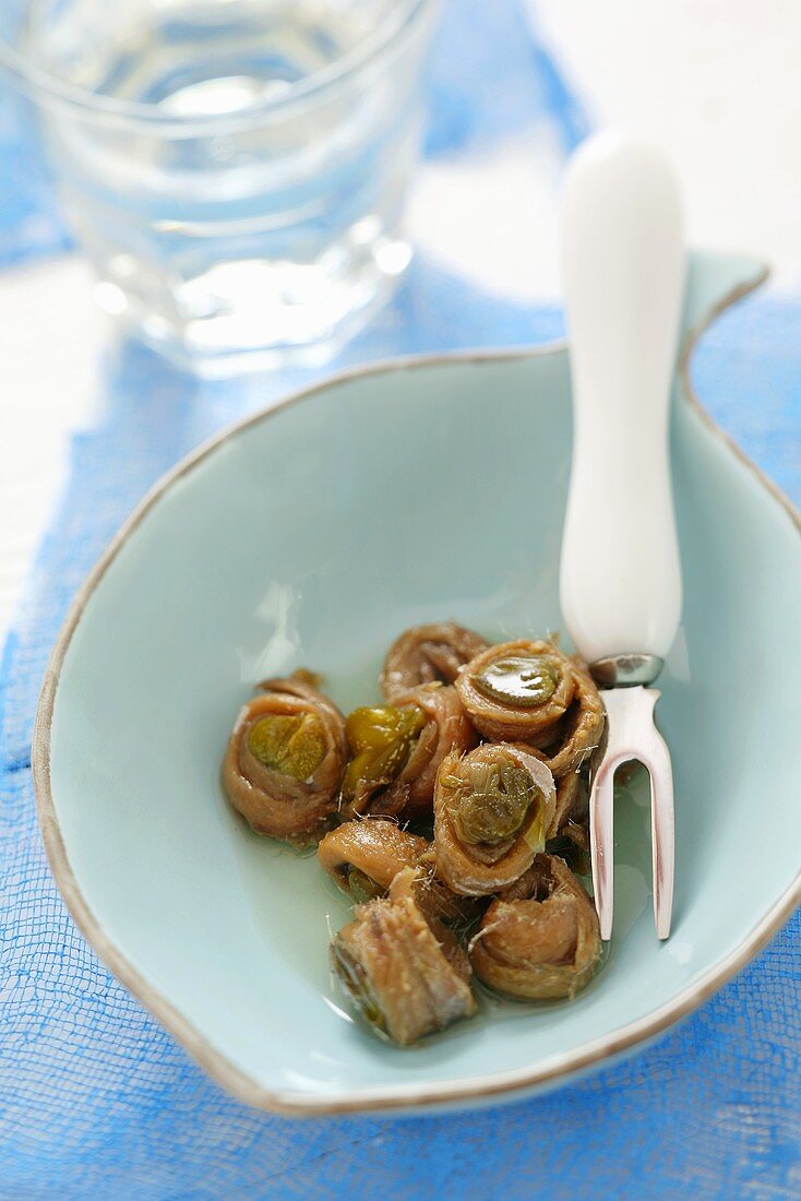 Capers pickled in oil, wrapped in anchovies