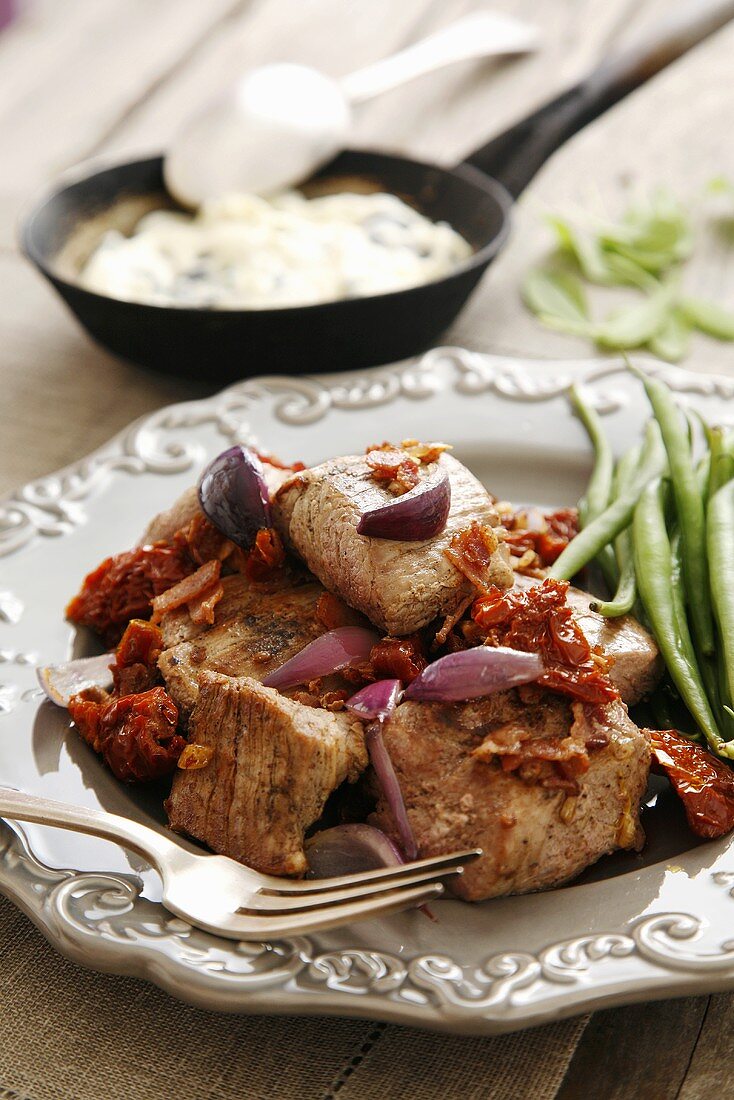 Pork with dried tomatoes, bacon, green beans