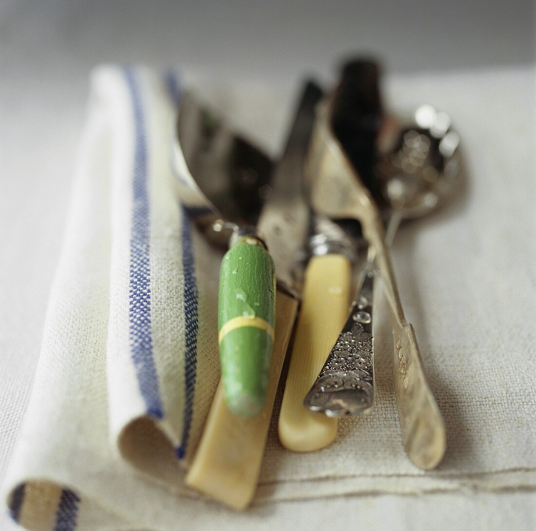 Old cutlery on a linen cloth