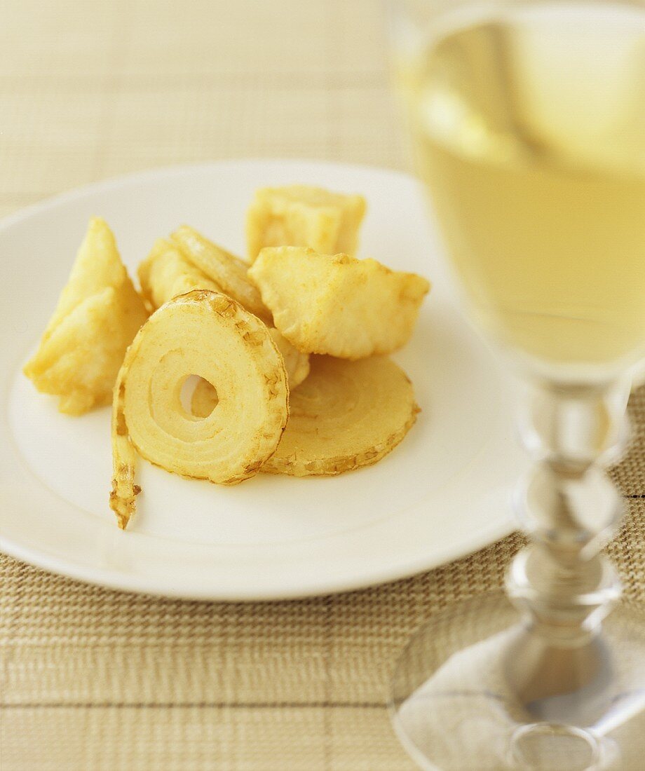 Fried onion & celeriac in batter with a glass of white wine
