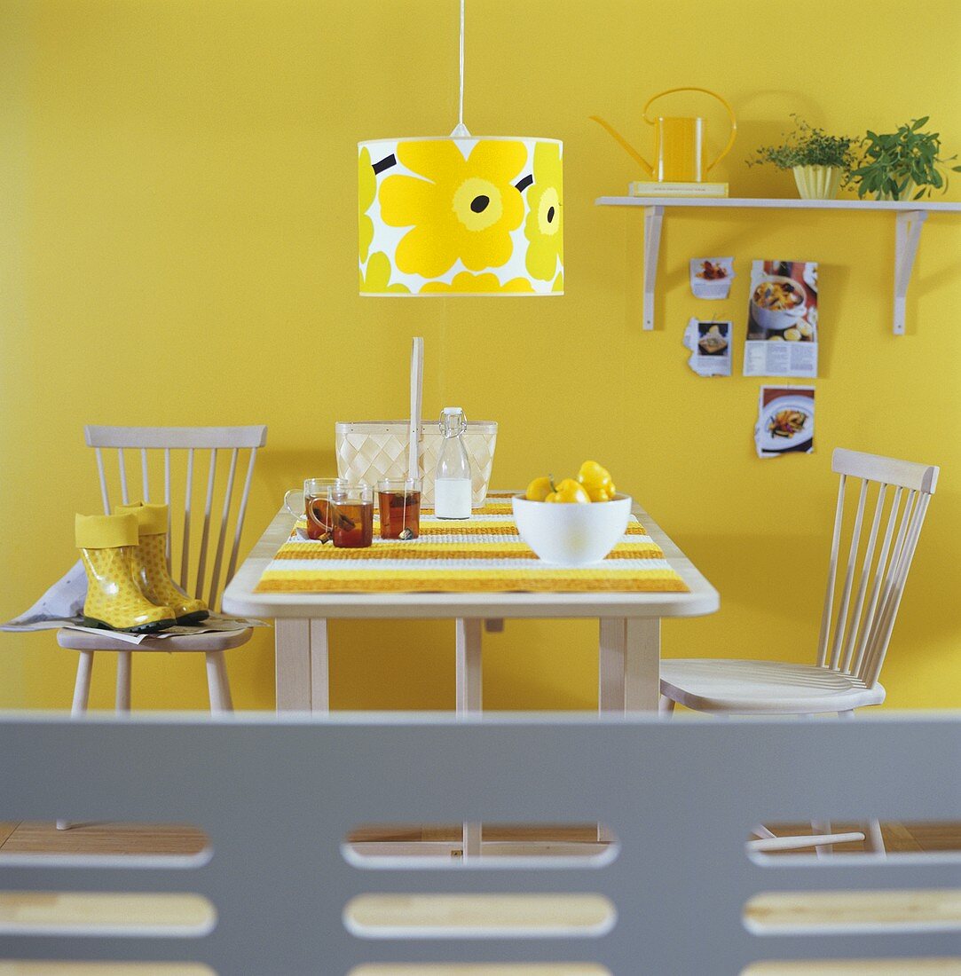 Kitchen table with cups of tea